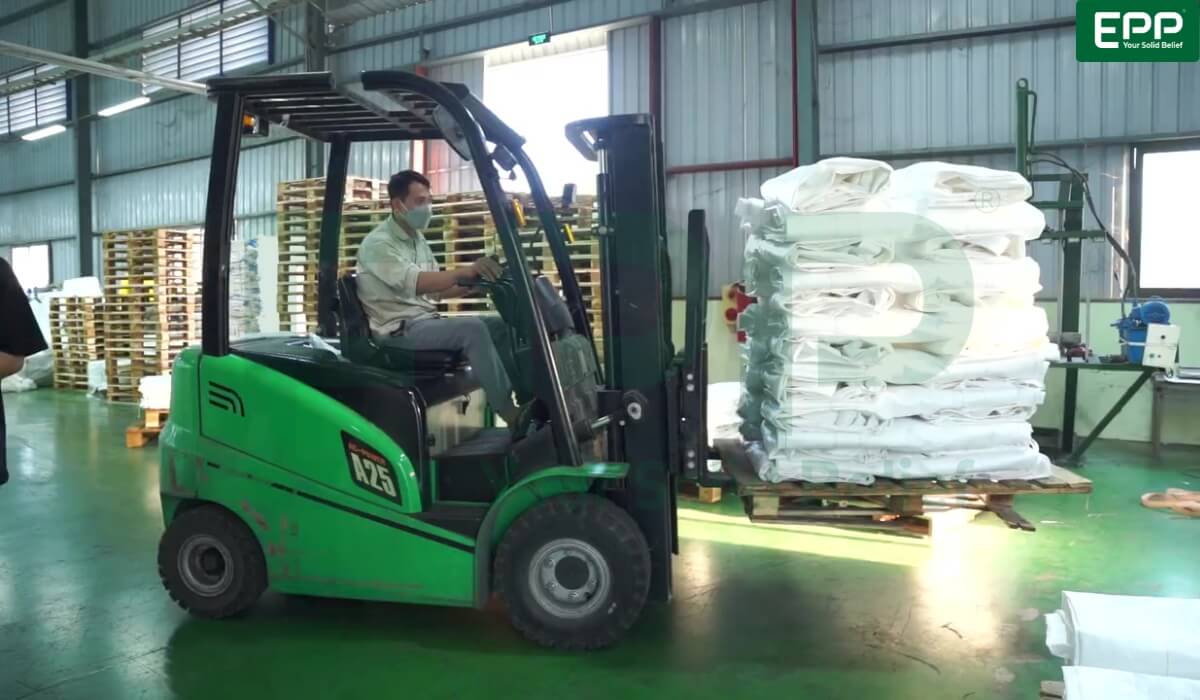 Compressed FIBC big bags staged for container loading in an ISO 14001 certified warehouse