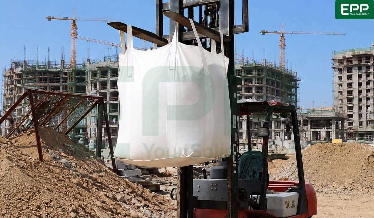 High-capacity builder bag with reinforced lifting loops suspended for heavy aggregate transport